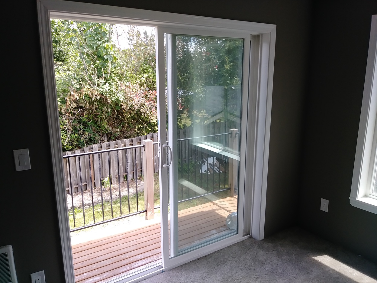 Sliding glass door casing installation completed, Seattle home