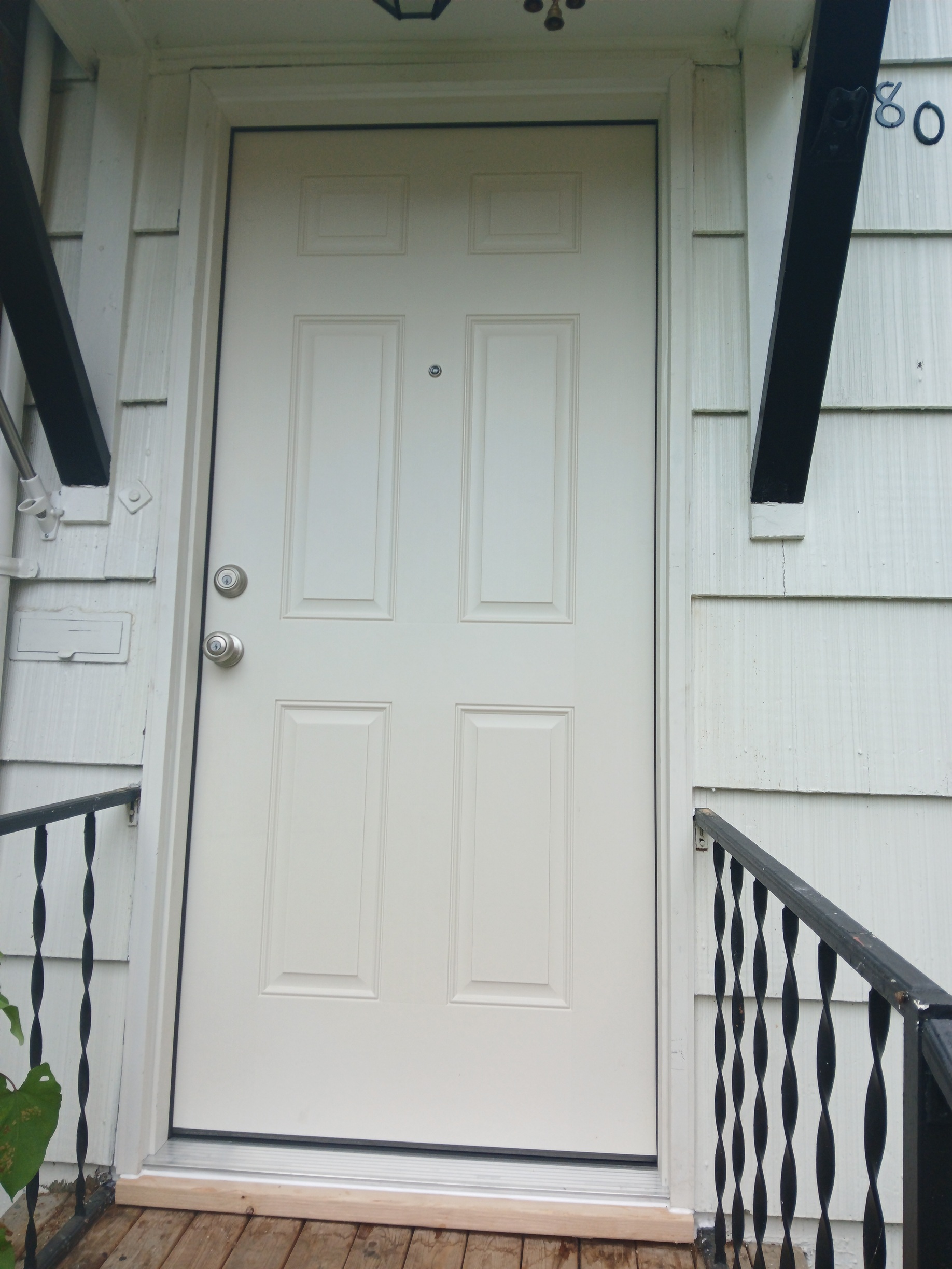 New exterior door installed on covered porch, Seattle home