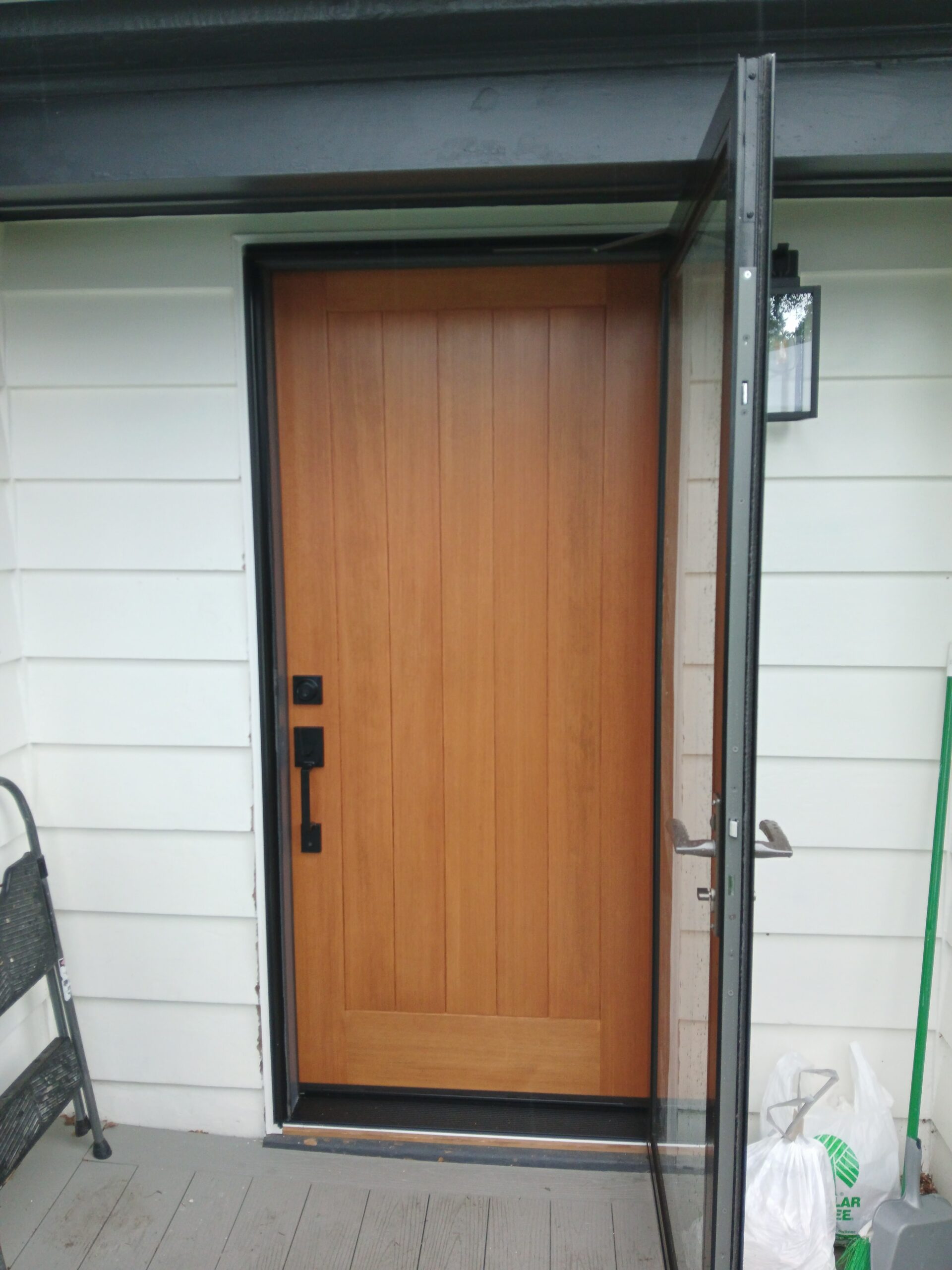 Wood exterior front door installed, Seattle home