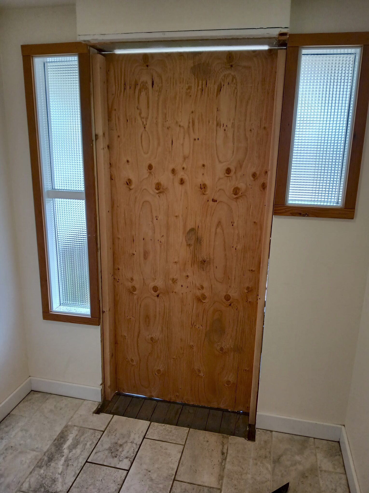 Wood exterior door before replacement, Seattle home