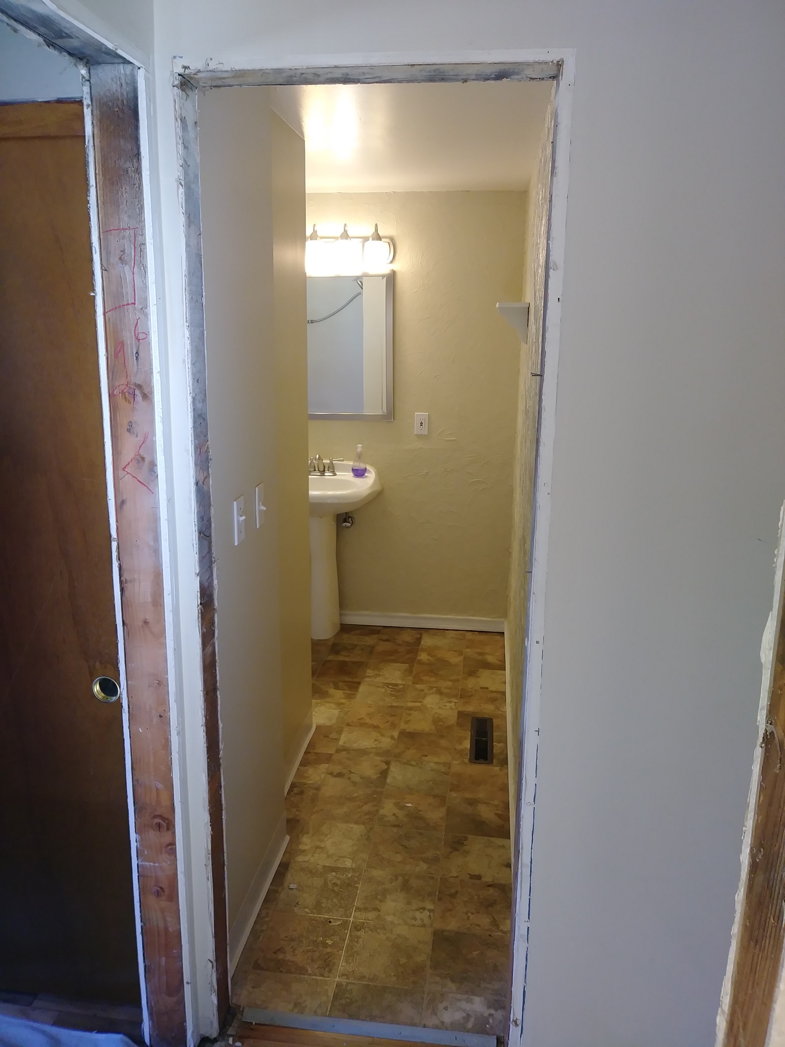 Wood exterior door before replacement, Seattle home