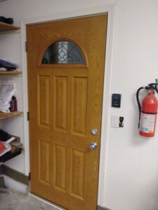 Wood exterior entry door with glass insert installed, Seattle