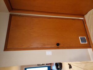 Existing wood exterior door before replacement, Seattle home