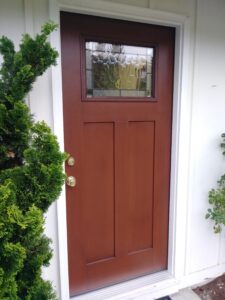 Dark wood exterior front door installed, Seattle home