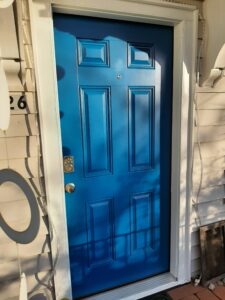 Teal painted exterior front door installed, Seattle home