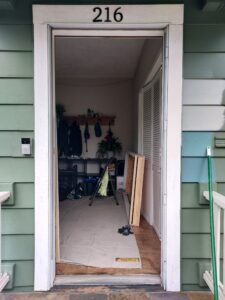 Green house exterior before new door installation, Seattle