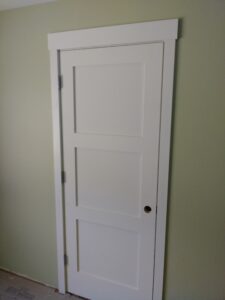 White interior swing door installed in Seattle bathroom