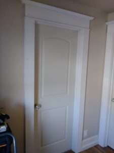 White interior swing door with casing installed, Seattle