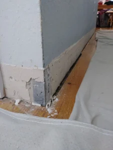 Room corner before baseboard molding installation, Seattle