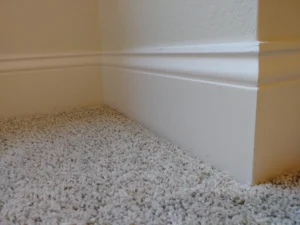 White baseboard molding installed along carpeted room, Seattle