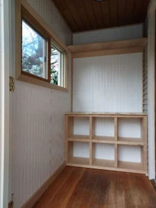 Finished custom built-in corner shelving unit, stained wood, Seattle