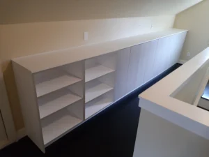 White custom built-in shelving unit installed, Seattle home