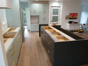 Completed kitchen with dark cabinet island installation, Seattle