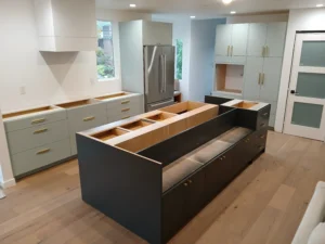 Finished dark kitchen cabinet installation with island, Seattle home