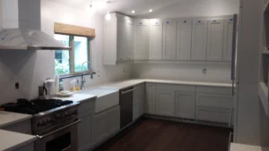 Completed white kitchen cabinet installation, Seattle home