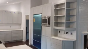 White kitchen cabinets and built-in shelving installed, Seattle remodel