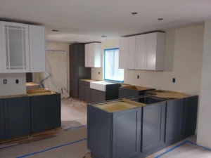 Completed dark gray kitchen cabinet installation with island, Seattle home
