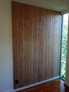 Completed vertical wood slat accent wall installed, Seattle home