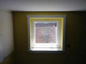 Window with white interior casing and trim installed, Seattle home