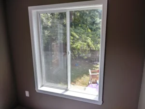 Window with completed white interior trim installed, Seattle