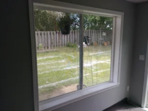 Window with new interior casing and trim installed, Seattle home