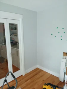 Empty room wall before built-in shelving installation