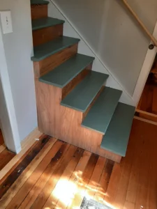 Completed staircase with painted risers and wood trim, Seattle