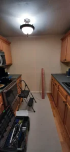 Hallway and kitchen before wood accent wall installation, Seattle
