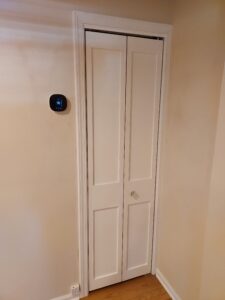 White bifold closet door installed, Seattle home