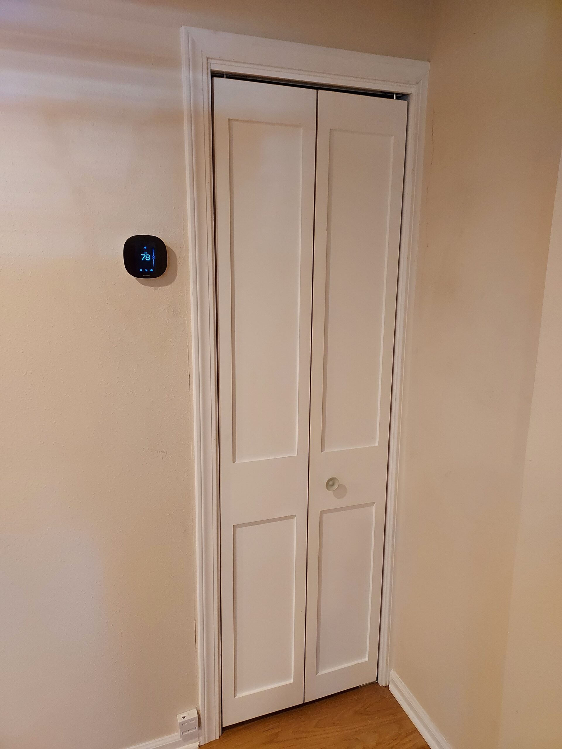 White bifold closet door installed, Seattle home