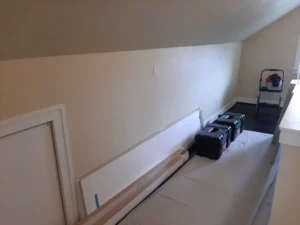 Empty wall before custom built-in shelving installation