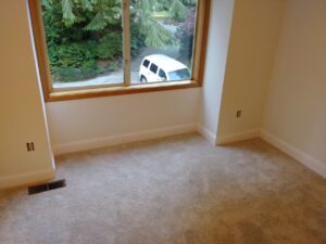 Completed baseboard trim in sunlit room, Seattle home