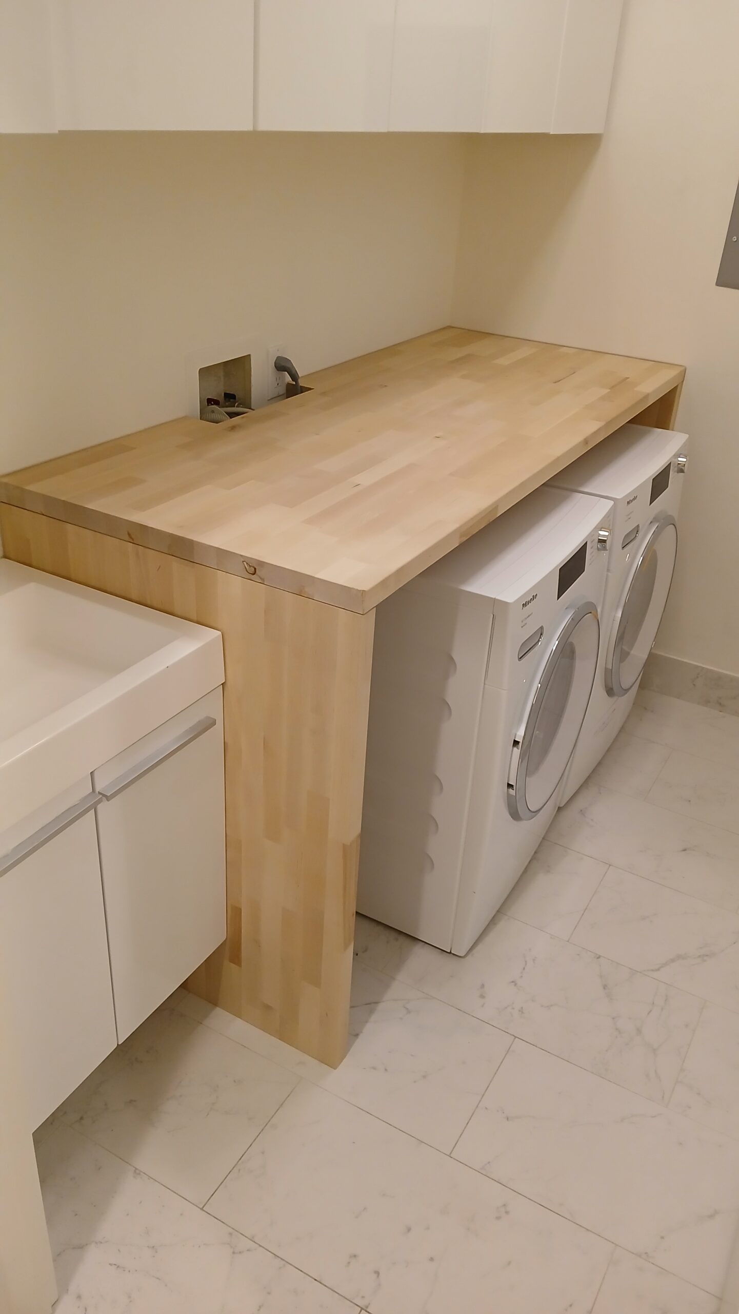 Laundry room built-in with butcher block countertop installed, Seattle home