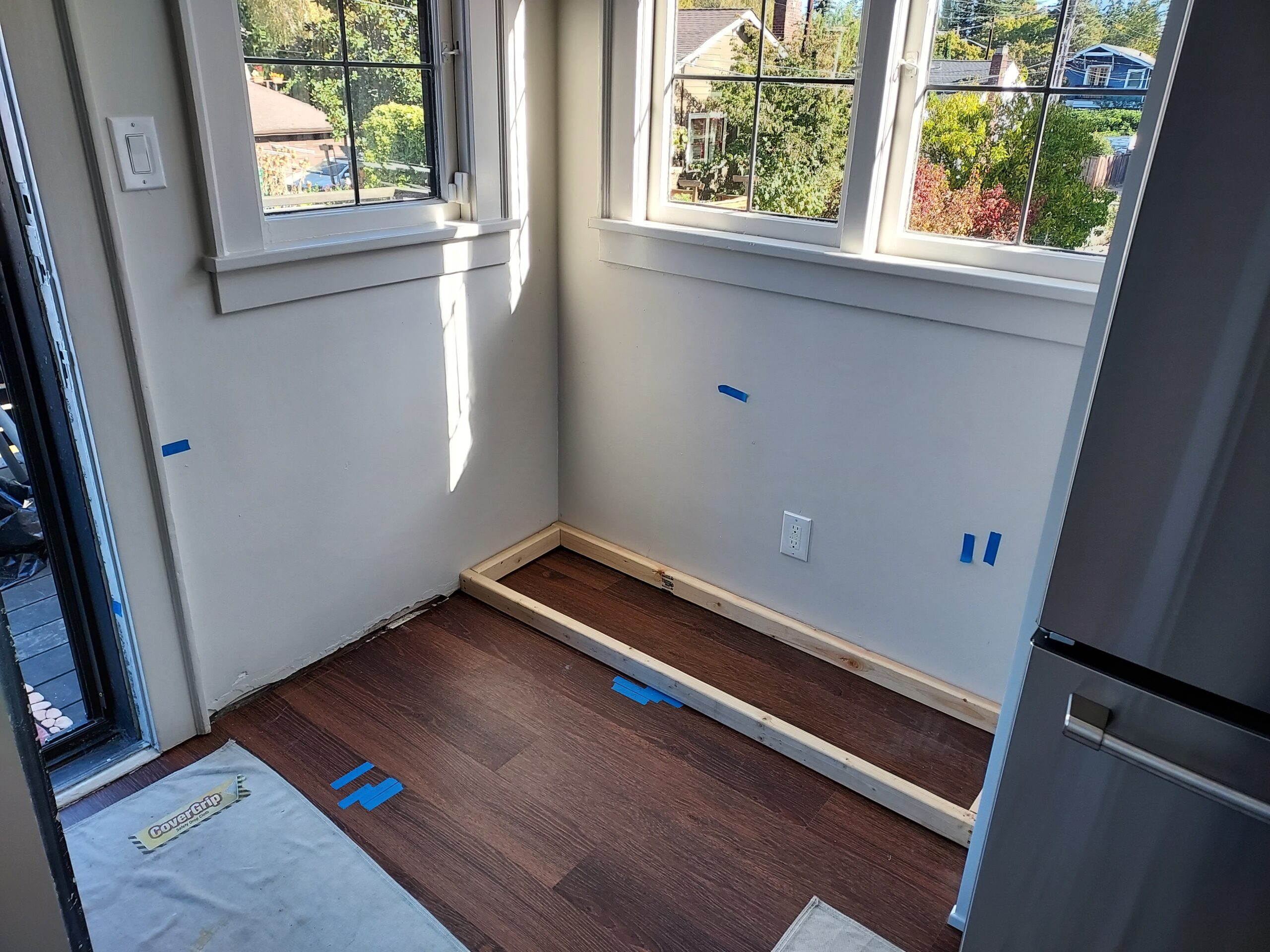 Sunroom before L-shaped window bench built-in installation, Seattle home
