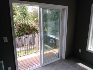 Sliding glass door casing installation completed, Seattle home