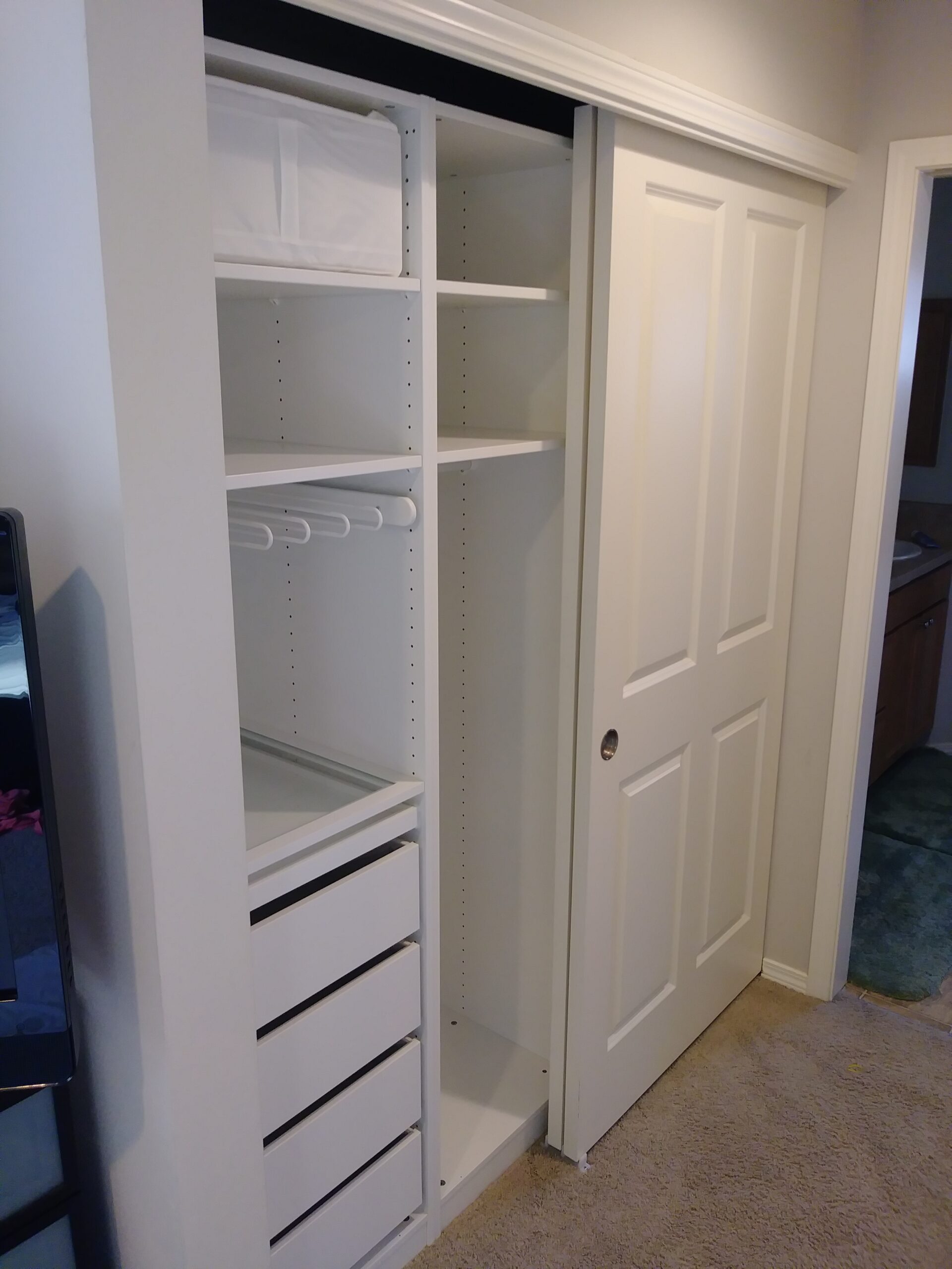 White built-in closet with drawers and shelves installed, Seattle home
