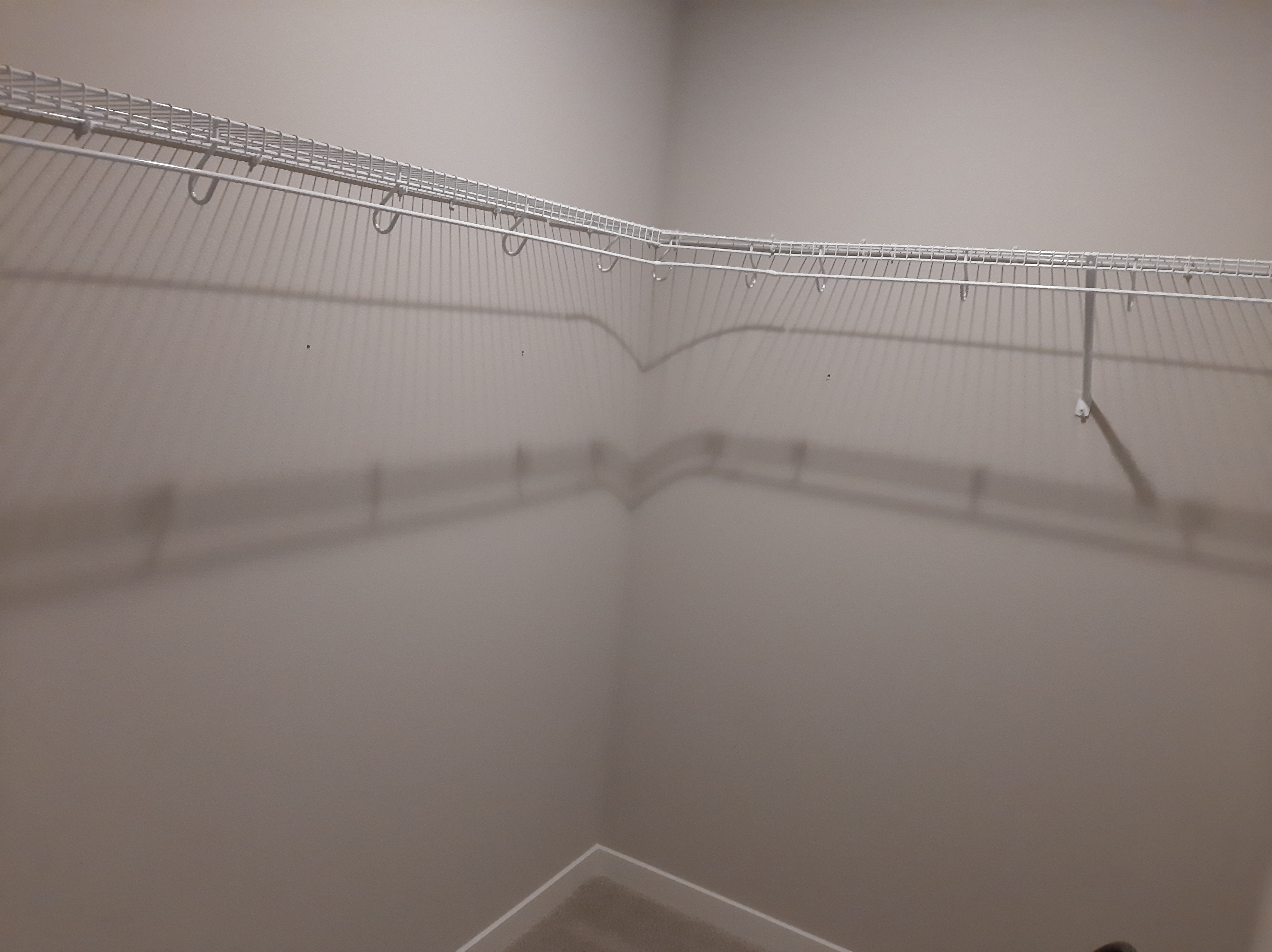 Empty corner closet before built-in installation, Seattle home
