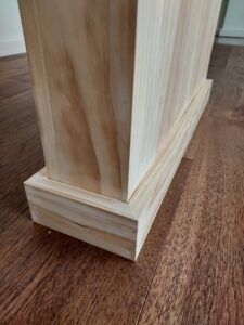 Decorative column installation detail, hardwood floor, Seattle home