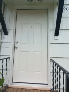 New exterior door installed on covered porch, Seattle home