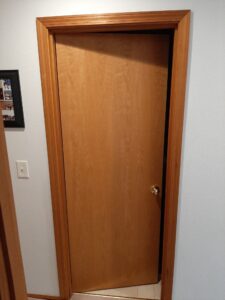 Wood interior door before installation, Seattle home