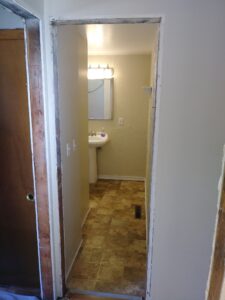 Wood exterior door before replacement, Seattle home